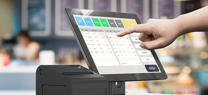 A Person's hand doing process payment on a touchscreen cash register, Point of Sale Software concept.